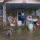 A woman on cellphone calls for help at her flooded residence in Lumberton, North Carolina, on Sept. 15, 2018 in the wake of Hurricane Florence.